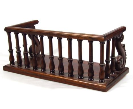 A mahogany D-end shelf, with galleried top and serpent scroll ends, with a moulded top rail on a plain block base, 18cm high,