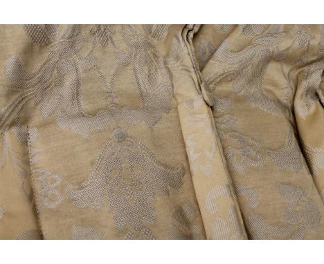 A set of drape curtains, in studded gilt gold coloured textured floral material, approximately 115" x47.5", with two tie back