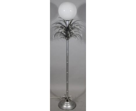 A 20thC retro standard lamp, in the form of a palm tree with bamboo stem, on domed foot, in silvered metal, probably 20thC, w