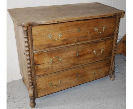 A 19thC style French hardwood chest, of three long drawers flanked by quarter bobbin turns on scroll feet, surmounted by a sh