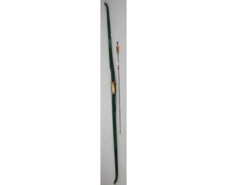 A bygone long bow, of D-end outline, painted green with a cord stringing and centre hand grip, 150cm high, and single arrow, 