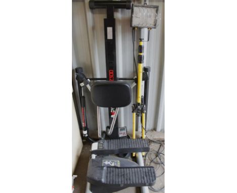 A heavy duty workman's tripod light, 137cm high, and an exercise machine. (2)