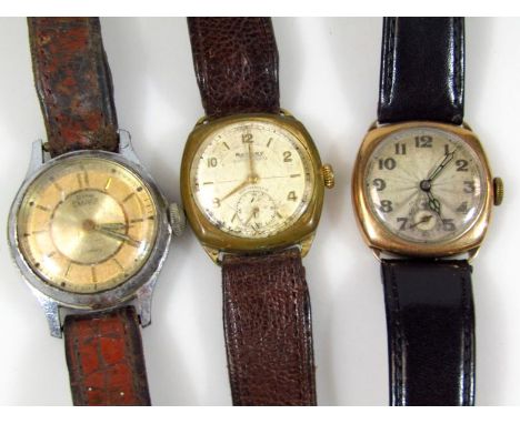 An early 20thC gentleman's wristwatch, with shaped 3cm wide dial, in gold case, a Rotary gents wristwatch in base metal case 