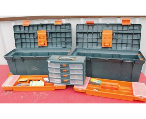 A modern heavy duty plastic tool cabinet, containing a small quantity of various bits, etc., 22cm high, 32cm wide, 14cm deep,