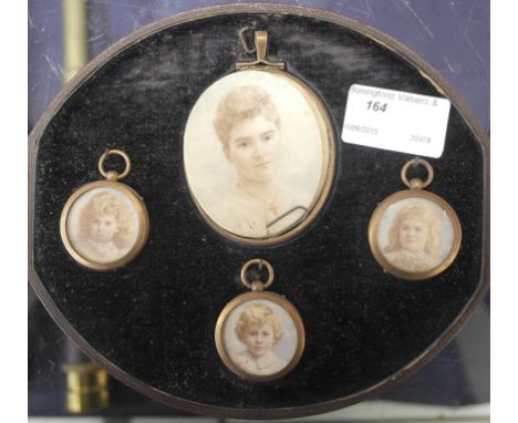 English School (19th/20th century): A cased set of four portrait miniatures on ivory depicting a woman & three children 