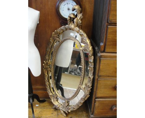A large Rococo-style gilt mirror