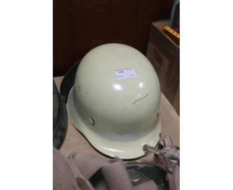 A folded rim German style helmet with flourescent band & neck brace as used by airport fire services