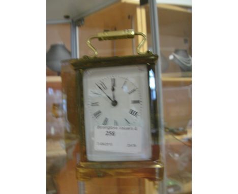 A cased brass carriage clock