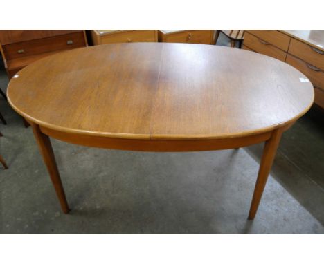 A Jentique 515 model teak extending dining table 