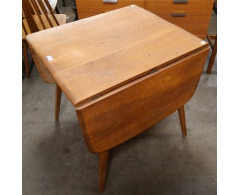 An Ercol elm and beech Windsor drop-leaf table 