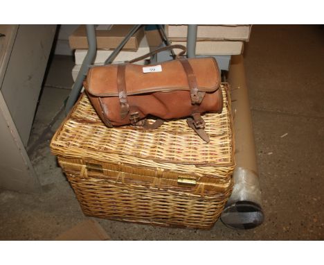 A wicker hamper and a pair of cased bowling woods