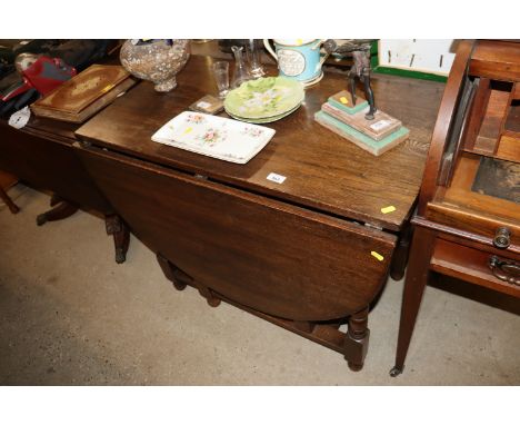 An oak gate leg dining table 