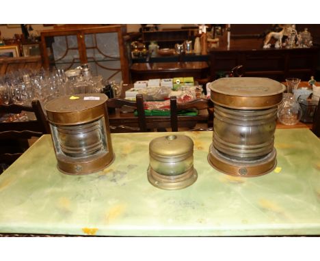 A brass ships stern and masthead lamps and a brass cased ships side light