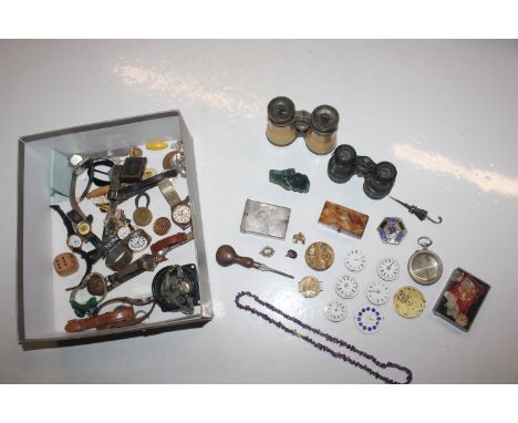 A box containing various wrist watches, watch movements, medallions, and an amethyst coloured necklace 