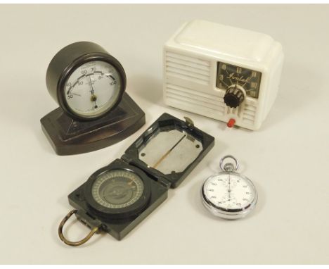 MARCHING COMPASS ETC.A military magnetic marching compass, Mark I, & a Lemania Nero chromium cased stopwatch in original box.