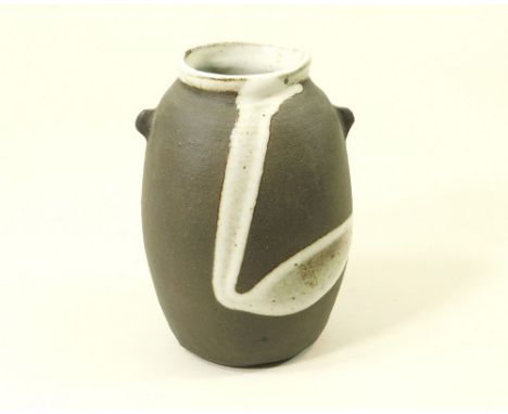JANET LEACH. A bottle vase with lugs &amp; trailed glaze decoration. Height 15.5cm. Personal &amp; Leach Pottery marks.