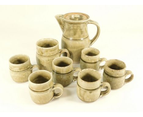 RICHARD BATTERHAM. A coffee pot, six similar matched mugs &amp; one other mug. Pot height 18cm.