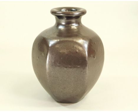 DAVID LLOYD JONES. A faceted bottle vase. Height 24cm. Impressed mark.