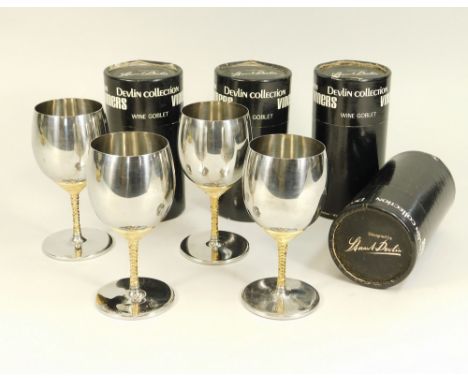 VINERS. Four Viners stainless steel wine goblets designed by Stuart Devlin, each boxed. Height including box 15cm.