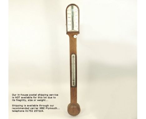 STICK BAROMETER.An oak cased stick barometer/thermometer by Cridge of London, with ivory scales & ivory adjuster. (Finial mis