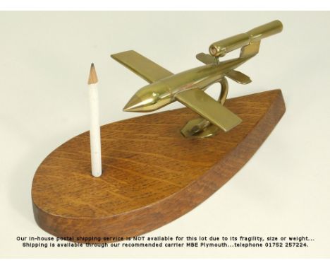 WWII VI FLYING BOMB MODEL. A brass wartime model of a VI (Doodlebug) flying bomb in the form of a desk cigarette lighter. Mou