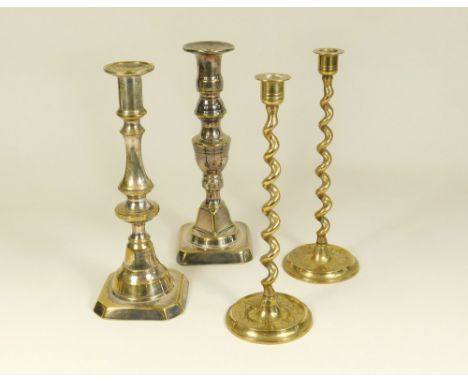 CANDLESTICKS. Two silver plated brass candlesticks &amp; a pair of Chinese brass candlesticks.