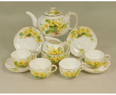 ROYAL WORCESTER. A Royal Worcester part tea service, hand painted with primroses, probably by Daisy Rae, comprising tea pot, 