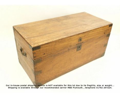 TRAVELLING CHEST. A 19th century mahogany bound travelling trunk, with cast iron handles. The interior wooden lined &amp; wit