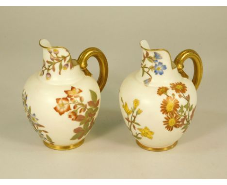 ROYAL WORCESTER. Two Royal Worcester No.1094 shaped small jugs. Height 13cm.