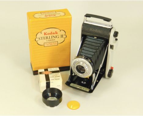 CAMERA ETC. A Kodak Sterling II camera with original box. Also, a Nebro filter, boxed.