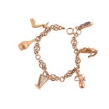 A 9CT GOLD CHARM BRACELET