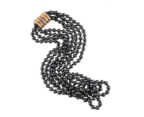 
	
		A HEMATITE BEAD NECKLACE WITH DIAMOND SET CLASP 
		Composed of four knotted strands of uniform polished hematite beads, 