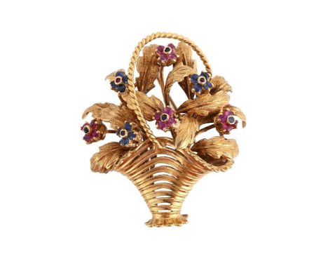 
	
		A GEM SET FLOWER BASKET BROOCH
		The pierced and reeded basket with ropetwist handle issuing a spray of textured leaves 