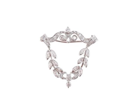 
	
		A DIAMOND PENDANT/BROOCH
		The openwork cartouche set with single, brilliant and marquise cut diamonds, vacant centre, u