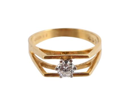 
	
		A DIAMOND SINGLE STONE RING
		BIRMINGHAM 1978
		The brilliant cut diamond between bifurcated bands of angular design, ab