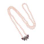 AN ANTIQUE GEM SET BUTTERFLY PANEL TO A LATER CULTURED PEARL NECKLACE