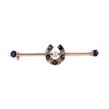 A LATE VICTORIAN SAPPHIRE, DIAMOND AND PEARL HORSESHOE BAR BROOCH, CIRCA 1890
