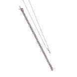 A DIAMOND PENDANT AND LINE BRACELET