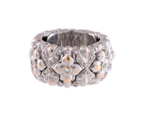 
	
		A DIAMOND SET BAND RING
		Of floral and geometric design, the front accented with brilliant cut diamonds, unmarked
		Siz
