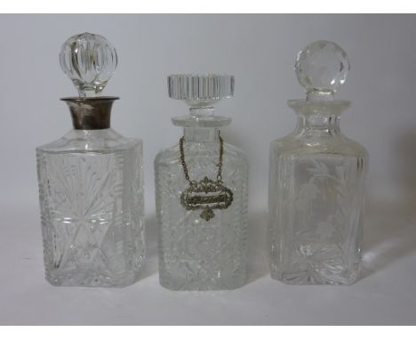 Cut crystal decanter with hallmarked silver collar H27.5cm and two other cut crystal decanters (3)
