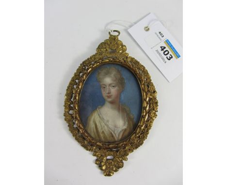 Bust Portrait of a young Lady, 18th century oval miniature on copper monogrammed HM 1707,  7.5cm x 6cm in cast gilt brass fra