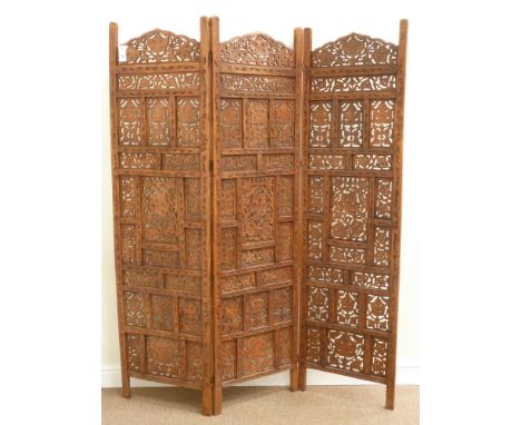 Eastern fretwork and carved three panel folding screen, W153cm, H183cm