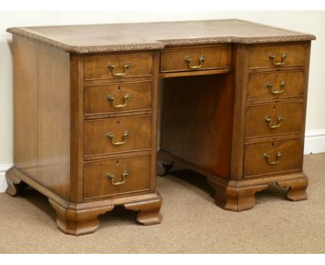 Early 19th century mahogany reverse breakfront kneehole desk fitted with eight graduating drawers and centre drawer, inset le