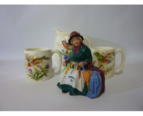 20th century Royal Worcester jug and two mug set hand painted with birds and foliage, and a Royal Doulton figure 'Silks and R