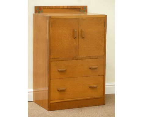 E Gomme small light oak tallboy fitted with double cupboard and two drawers, W61cm, H97cm, D41cm