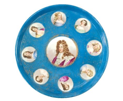 A Sèvres style circular tray with central portrait of Louis XIV and surround of eight portraits of his mistresses, within scr