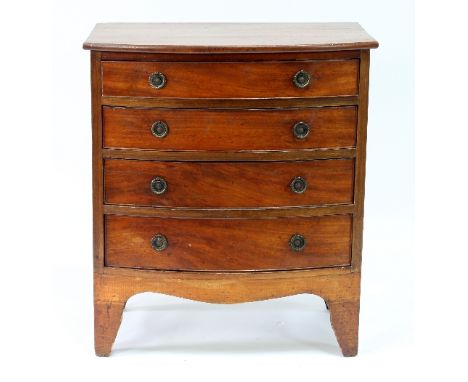 A small mahogany bowfront chest of four drawers on bracket feet, 60.5cm wide