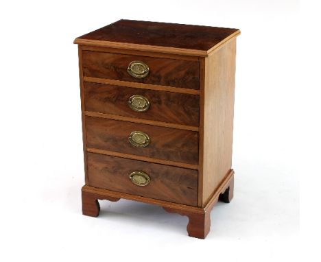 A small mahogany chest fitted four drawers on bracket feet, 53cm wide