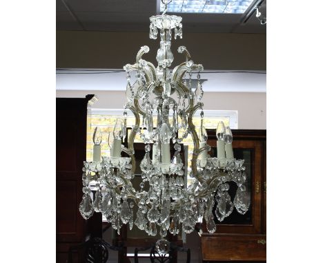 A cut glass eight-light chandelier hung with prismatic drops, 90cm x 60cm