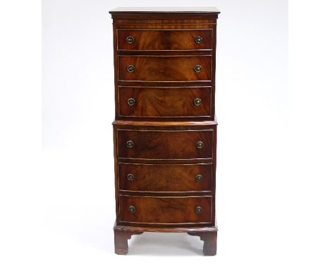 A mahogany bowfront tallboy chest, fitted six drawers on bracket feet, 55cm wide